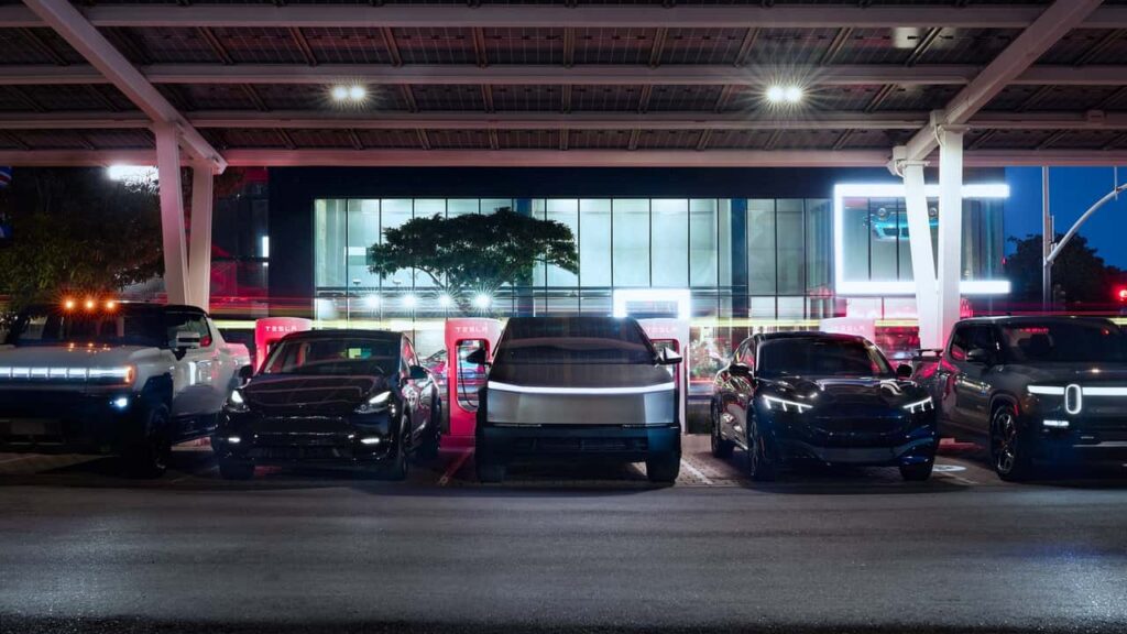 hummer-ev-tesla-model-y-tesla-cybertruck-ford-mustang-mach-e-and-rivian-r1t-at-a-tesla-supercharger.jpeg